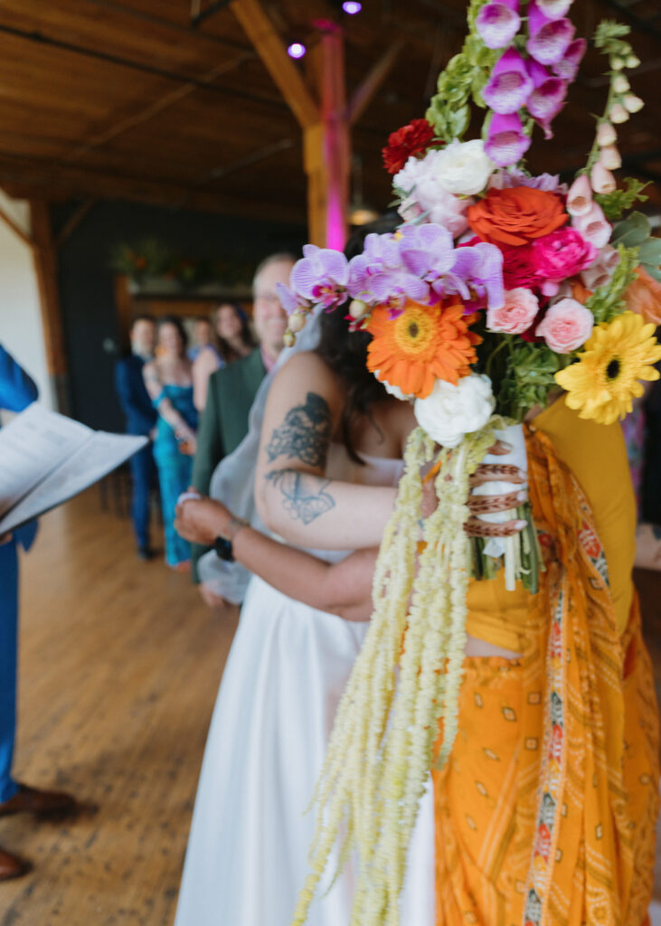 Bride hugs her mother during an emotional moment before the wedding ceremony.