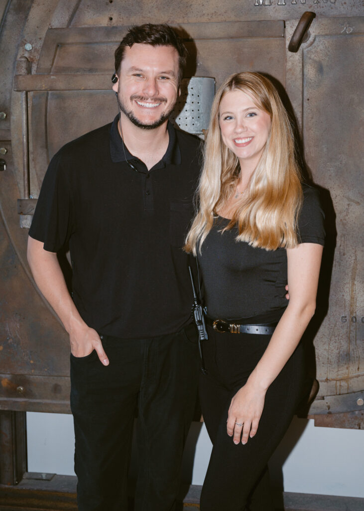 Wedding planners smile together for a portrait during the reception at Solar Arts Building in Minneapolis.
